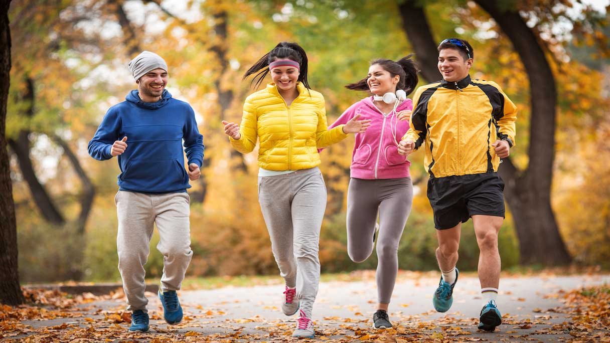 Group of adults running outside