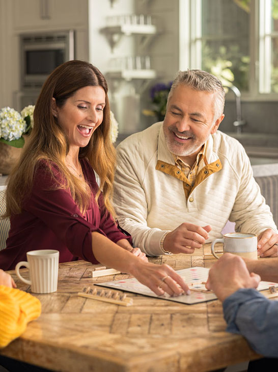 Man and woman playing board game