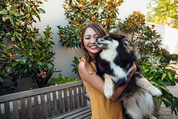 Woman holding dog