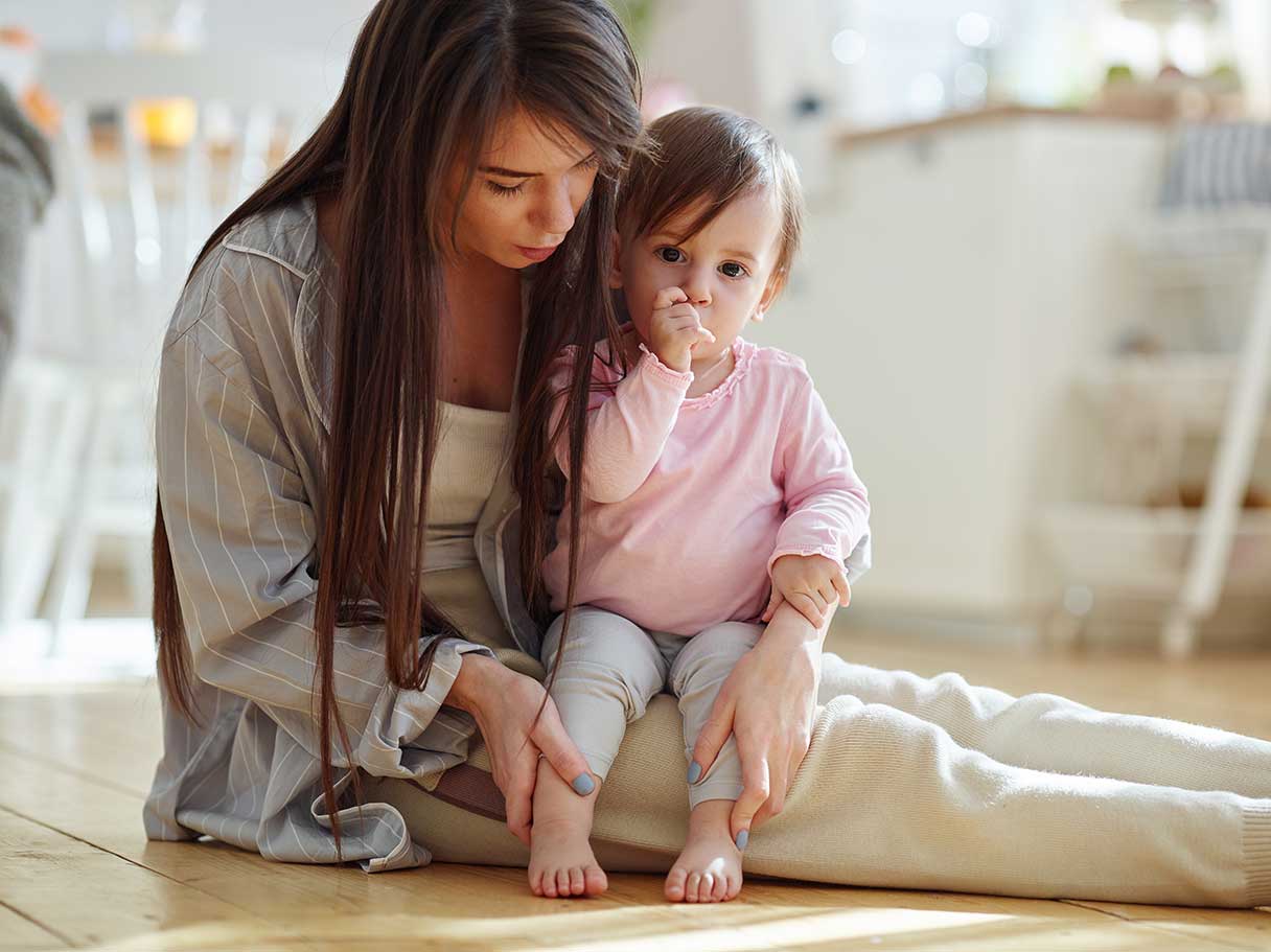 Woman holding infant on her lap