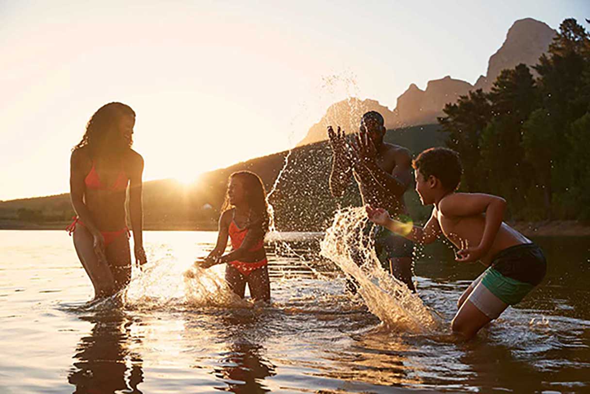 Family splashing in lake