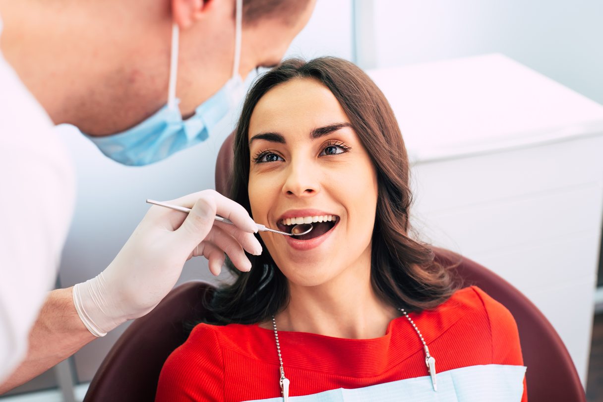 Woman having mouth examined