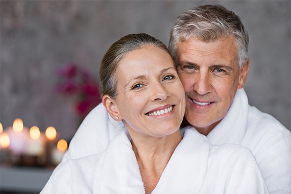 Man and woman in day spa robes