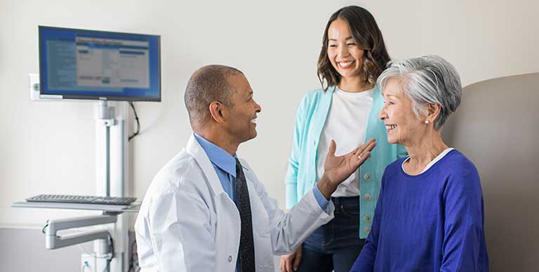 Doctor speaking with two women