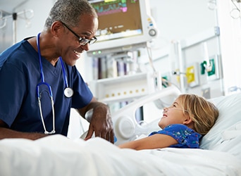 Doctor speaking with a young girl