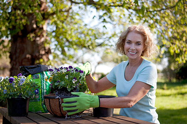 Woman outside gardening 