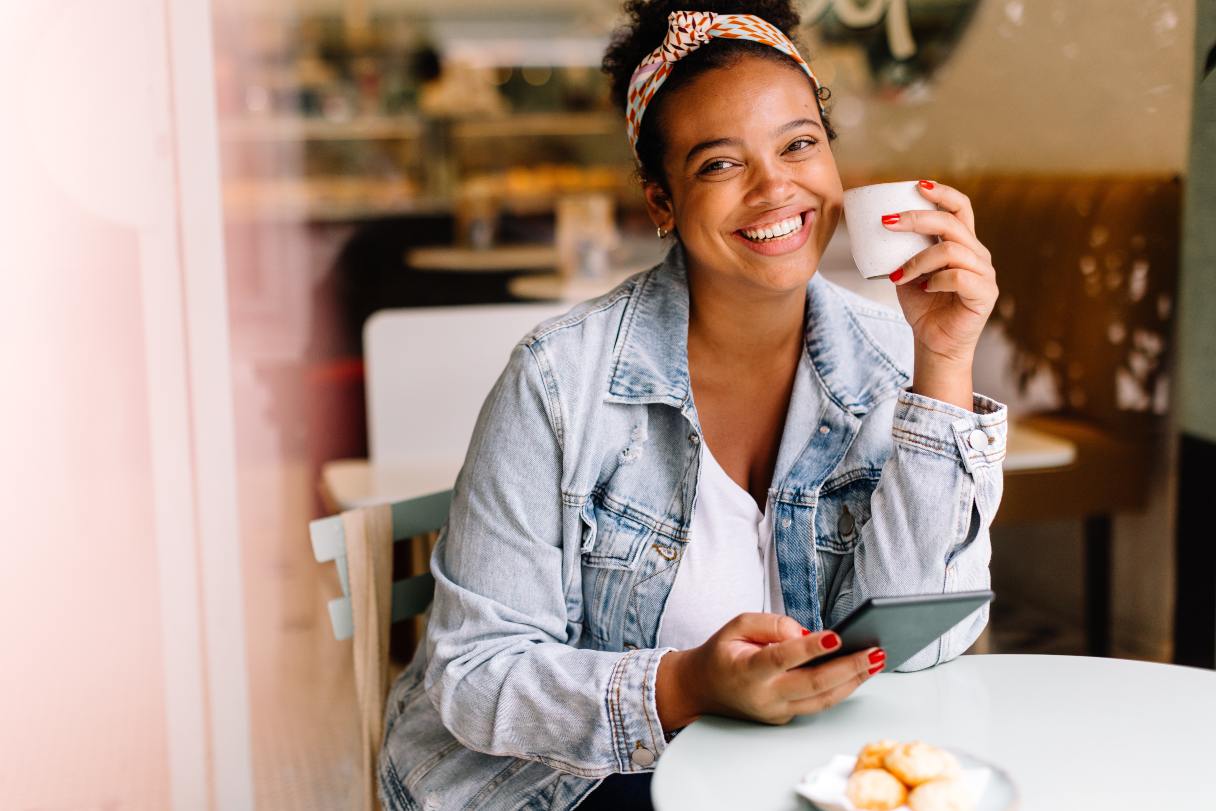 Smiling woman drinking coffee