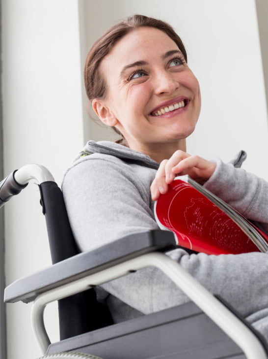 Smiling woman sitting in wheelchair