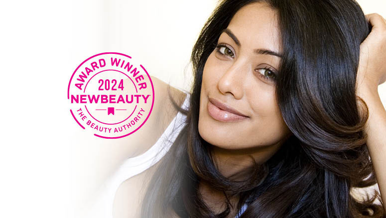 Woman with dark hair with 2024 New Beauty award seal