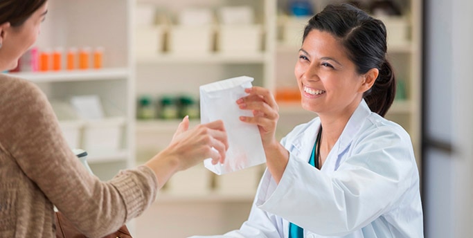 Pharmacist filling prescription