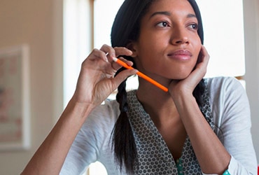 Woman holding pencil