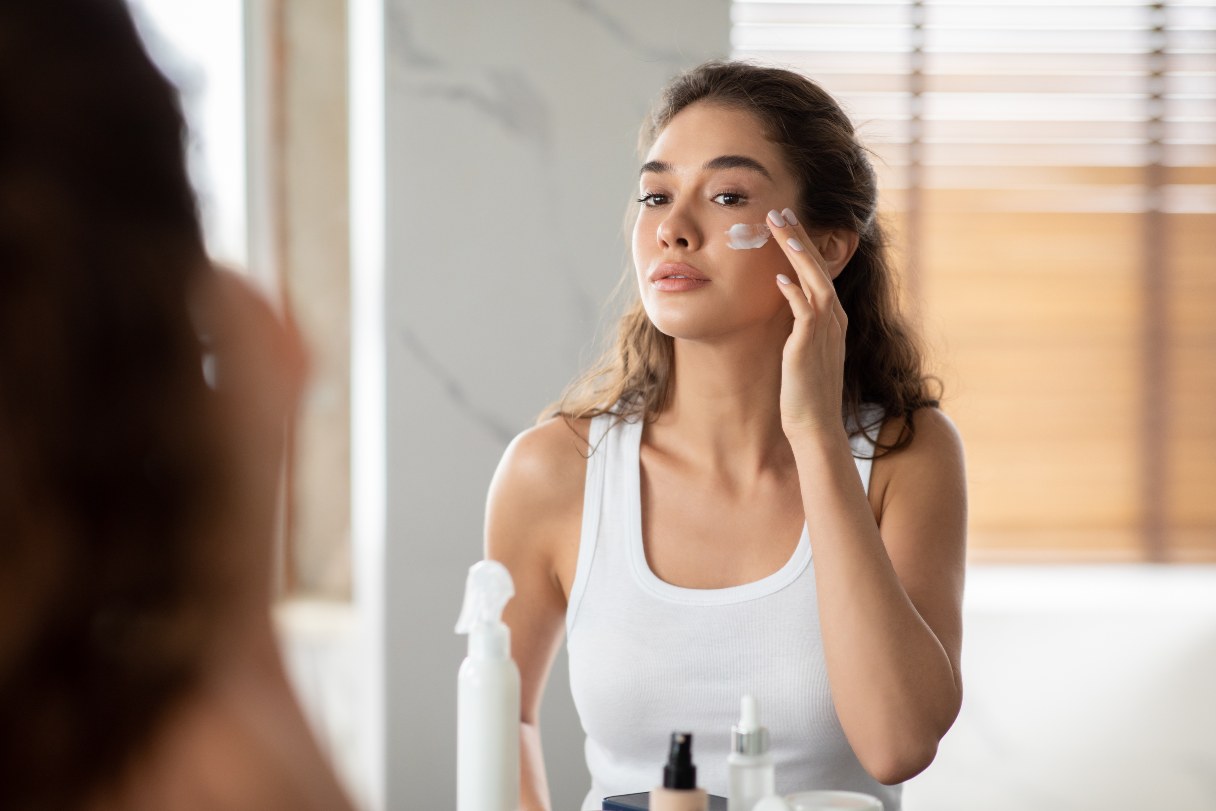 Woman applying skin care