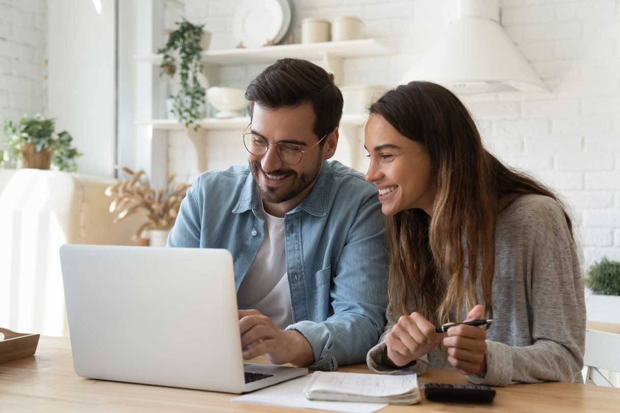 Couple working at laptop