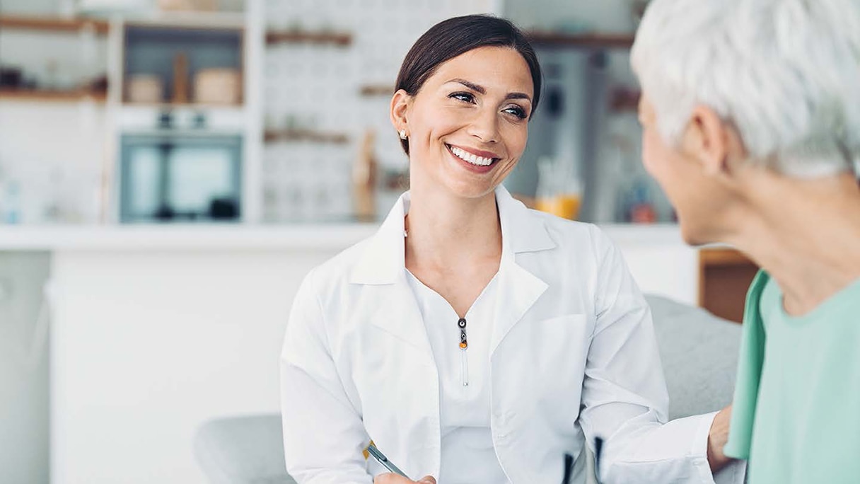 Doctor smiling at patient