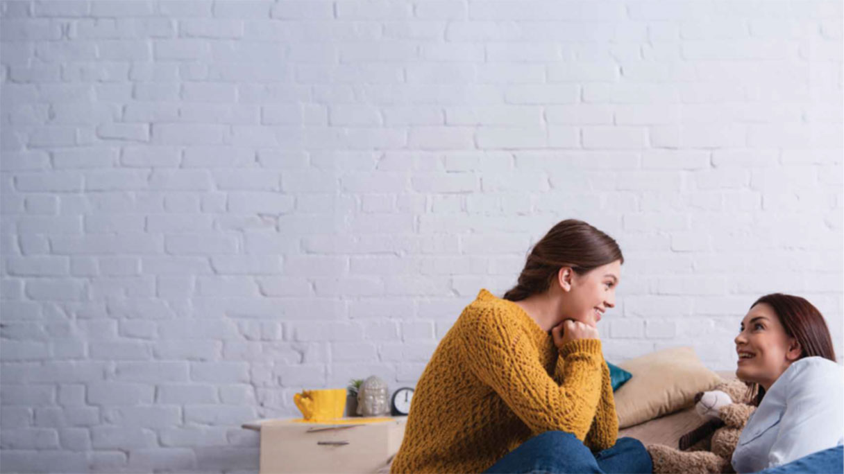 Woman and girl talking to each other